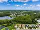 Beautiful aerial shot of homes near a lake surrounded by trees at 21395 Southern Charm Dr, Land O Lakes, FL 34637