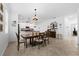 A dining area with a table and chairs is visible, next to a kitchen at 21395 Southern Charm Dr, Land O Lakes, FL 34637