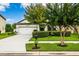 Beautiful two-story home with manicured lawn and landscaping and well-lit street at 21395 Southern Charm Dr, Land O Lakes, FL 34637