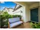 Cozy front porch with a bench and a view of the entryway at 21395 Southern Charm Dr, Land O Lakes, FL 34637