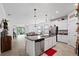 Open-concept kitchen with stainless steel appliances, granite countertops, and tile flooring at 21395 Southern Charm Dr, Land O Lakes, FL 34637