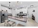Light and bright kitchen with island, stainless steel appliances and granite countertops at 21395 Southern Charm Dr, Land O Lakes, FL 34637