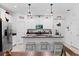 Modern kitchen featuring granite countertops, stainless steel appliances, and an island with seating at 21395 Southern Charm Dr, Land O Lakes, FL 34637