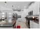 Bright kitchen features an island with granite countertops, stainless steel appliances, and white cabinetry at 21395 Southern Charm Dr, Land O Lakes, FL 34637