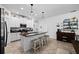 Beautiful kitchen with stainless steel appliances, white cabinetry and spacious center island with seating at 21395 Southern Charm Dr, Land O Lakes, FL 34637