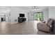 Open living space with neutral colors and sliding glass doors to the lanai at 21395 Southern Charm Dr, Land O Lakes, FL 34637