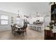 Open-concept living space features dining area and kitchen at 21395 Southern Charm Dr, Land O Lakes, FL 34637