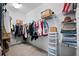 A well-organized walk-in closet maximizes storage space with shelves, rods, and drawers at 21395 Southern Charm Dr, Land O Lakes, FL 34637