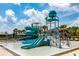 Modern pool area featuring a splash pad with slides and recreational water features for  at 2388 Oakwood Preserve Dr, Wesley Chapel, FL 33543