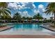 Resort-style swimming pool with lounge chairs and cabanas provides a perfect spot for relaxation at 2388 Oakwood Preserve Dr, Wesley Chapel, FL 33543