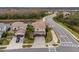 A beautiful home featuring lush landscaping, a tile roof, and a lake view at 2388 Oakwood Preserve Dr, Wesley Chapel, FL 33543