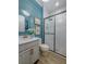 Modern bathroom with frameless glass shower, stylish vanity, and beautiful tile work at 2388 Oakwood Preserve Dr, Wesley Chapel, FL 33543