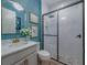 Modern bathroom with frameless glass shower, stylish vanity, and beautiful tile work at 2388 Oakwood Preserve Dr, Wesley Chapel, FL 33543