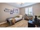 This bedroom features light gray walls, wood floors, shuttered window and is decorated with baseball themed decor at 2388 Oakwood Preserve Dr, Wesley Chapel, FL 33543