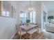 Cozy breakfast nook featuring a built-in bench, charming light fixture, and bright windows at 2388 Oakwood Preserve Dr, Wesley Chapel, FL 33543