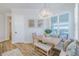 Dining area with a wooden table, bench seating, and floral patterned pillows at 2388 Oakwood Preserve Dr, Wesley Chapel, FL 33543