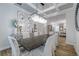 Charming dining area featuring chandelier, wall art, and stylish buffet at 2388 Oakwood Preserve Dr, Wesley Chapel, FL 33543