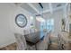 Elegant dining room with coffered ceilings, a decorative mirror, and a modern chandelier at 2388 Oakwood Preserve Dr, Wesley Chapel, FL 33543