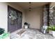 Bright entryway with a glass double door, chandelier, large mirror, bench, and hardwood floors at 2388 Oakwood Preserve Dr, Wesley Chapel, FL 33543