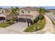 Beautiful two-story home featuring a paver driveway, an attached two-car garage, and lovely landscaping at 2388 Oakwood Preserve Dr, Wesley Chapel, FL 33543