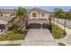 Beautiful two-story home featuring a paver driveway, an attached two-car garage, and lovely landscaping at 2388 Oakwood Preserve Dr, Wesley Chapel, FL 33543
