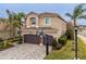 Beautiful two-story home featuring a paver driveway, an attached two-car garage, and lovely landscaping at 2388 Oakwood Preserve Dr, Wesley Chapel, FL 33543