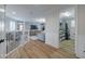 Hallway view towards the living room and a laundry room with modern washer and dryer at 2388 Oakwood Preserve Dr, Wesley Chapel, FL 33543