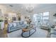 Spacious open-plan living room with a view of the kitchen and dining area at 2388 Oakwood Preserve Dr, Wesley Chapel, FL 33543