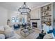 Living room with a fireplace, built-in shelves, and stylish decor at 2388 Oakwood Preserve Dr, Wesley Chapel, FL 33543