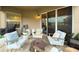 Covered patio features comfortable seating, an outdoor area for games and a view of the backyard and neighborhood at 2388 Oakwood Preserve Dr, Wesley Chapel, FL 33543