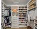 A beautifully organized walk-in closet features custom shelving and ample storage space at 2388 Oakwood Preserve Dr, Wesley Chapel, FL 33543