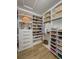 A beautifully organized walk-in closet features custom shelving and ample storage space at 2388 Oakwood Preserve Dr, Wesley Chapel, FL 33543