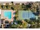 Aerial view of community pool, tennis court and community buildings at 2400 Winding Creek Blvd # 4-101, Clearwater, FL 33761