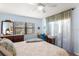 Serene bedroom with wood flooring, natural light, and a dedicated workspace at 2400 Winding Creek Blvd # 4-101, Clearwater, FL 33761