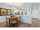 Eat-in kitchen features stainless appliances, white cabinets, and stylish decor at 2400 Winding Creek Blvd # 4-101, Clearwater, FL 33761