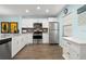 Bright kitchen with stainless steel appliances, white cabinets, and modern countertops at 2400 Winding Creek Blvd # 4-101, Clearwater, FL 33761