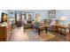 Comfortable living room with plush seating, natural light, and hardwood floors at 2400 Winding Creek Blvd # 4-101, Clearwater, FL 33761