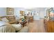 Spacious living room featuring an open floorplan to the kitchen and dining area at 2400 Winding Creek Blvd # 4-101, Clearwater, FL 33761