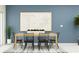Stylish dining room with a wooden table, black chairs, and contemporary decor at 246 27Th Se St, Ruskin, FL 33570