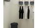 Organized walk-in closet with hanging clothes and storage baskets for efficient space utilization at 246 27Th Se St, Ruskin, FL 33570