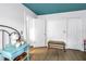Bedroom with blue ceiling, white walls, and light wood-look flooring at 2475 Bay Berry Dr, Clearwater, FL 33763