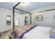 Bedroom with ensuite bath boasts a luxury bed and connects to a stylish bathroom at 2475 Bay Berry Dr, Clearwater, FL 33763