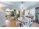 Formal dining room with chandelier open to the living room and kitchen at 2475 Bay Berry Dr, Clearwater, FL 33763