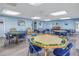 Resident's game room provides tables for cards and board games at 2475 Bay Berry Dr, Clearwater, FL 33763