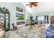 Inviting living room featuring stylish furnishings, elegant decor, a cozy fireplace, and abundant natural light at 2475 Bay Berry Dr, Clearwater, FL 33763