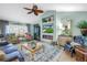 Sophisticated living room with vaulted ceilings, tasteful decor, fireplace, and ample seating, perfect for relaxation and entertaining at 2475 Bay Berry Dr, Clearwater, FL 33763