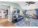 Bright and spacious living room featuring stylish furniture, hardwood floors, and seamless flow to the adjacent dining area at 2475 Bay Berry Dr, Clearwater, FL 33763