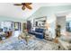 Bright and airy living room featuring stylish furniture, hardwood floors, and open layout connecting to the dining area at 2475 Bay Berry Dr, Clearwater, FL 33763