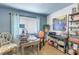 Well-lit home office with a large window, comfortable seating, and ample storage space at 2475 Bay Berry Dr, Clearwater, FL 33763
