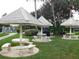 Outdoor picnic area offering multiple shaded tables surrounded by lush landscaping at 2475 Bay Berry Dr, Clearwater, FL 33763
